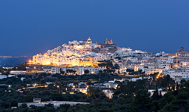 View of typical architecture and white houses of the old medieval town at dusk, Ostuni, Province of Brindisi, Apulia, Italy, Europe