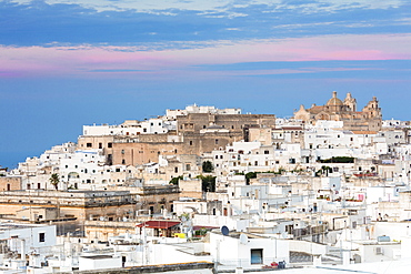 View of typical architecture and white houses of the old medieval town at sunset, Ostuni, Province of Brindisi, Apulia, Italy, Europe