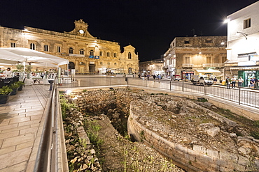 Night view of the Town Hall and ancient ruins in the medieval old town of Ostuni, Province of Brindisi, Apulia, Italy, Europe