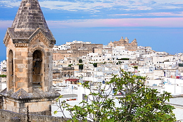 View of typical architecture and white houses of the old medieval town at sunset, Ostuni, Province of Brindisi, Apulia, Italy, Europe