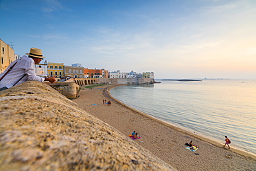 Sunset frames the beach and the turquoise sea, Gallipoli, Province of Lecce, Apulia, Italy, Europe