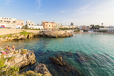 Turquoise sea and cliffs frame the fishing village of Santa Maria al Bagno Gallipoli, Province of Lecce, Apulia, Italy, Europe