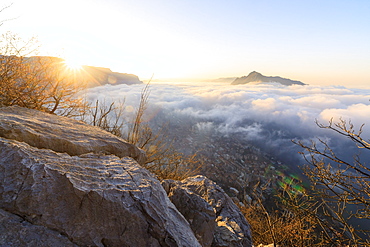 Sun and mist above the city of Lecco seen from Monte San Martino, Province of Lecco, Lombardy, Italy, Europe