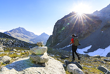 Hiker on the trail to Lej Lagrev, St. Moritz, Engadine, Canton of Graubunden, Switzerland, Europe