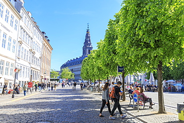 People walk in the pedestrian road towards Christiansborg Palace, Copenhagen, Denmark, Europe