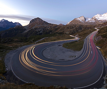 Panoramic of lights of car traces, Bernina Pass, Poschiavo Valley, Engadine, Canton of Graubunden, Switzerland, Europe