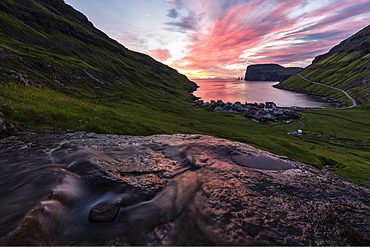 Water of creek flows on rocks, Tjornuvik, Sunda Municipality, Streymoy Island, Faroe Islands, Denmark, Europe