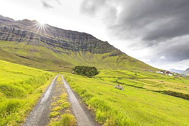 Sunbeam on green meadows, Kunoy Island, Nordoyar, Faroe Islands, Denmark, Europe