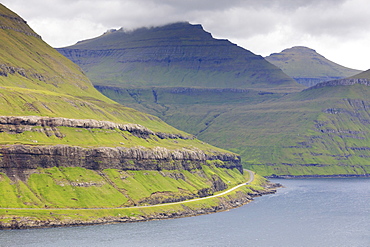 Road along mountain towards Funningur, Eysturoy Island, Faroe Islands, Denmark, Europe