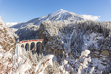 Bernina Express train on Landwasser Viadukt, UNESCO World Heritage Site, Filisur, Albula Valley, Canton of Graubunden, Switzerland, Europe