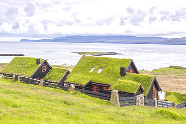 Traditional houses with grass (turf) roof, Kirkjubour, Streymoy island, Faroe Islands, Denmark, Europe