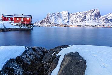 Traditional fisherman's huts (Rorbu) on the icy sea, Reine Bay, Lofoten Islands, Nordland, Norway, Europe