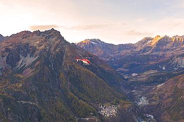 Aerial view of helicopter in flight over Primolo, Valmalenco, Valtellina, Lombardy, province of Sondrio, Italy, Europe