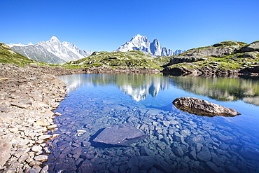 The Mont Blanc mountain range reflected in the waters of Lac des Cheserys, Haute Savoie, French Alps, France, Europe