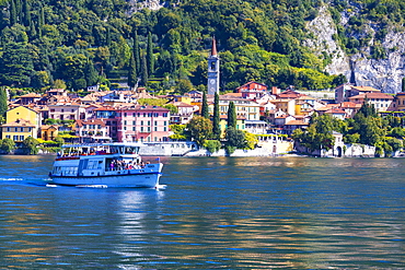 People on boat trip around the village of Varenna, Lake Como, Lecco province, Lombardy, Italian Lakes, Italy, Europe