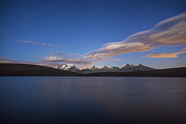 View of Gran Paradiso range at sunset from Lake Rossett (Lago Rossett), Colle del Nivolet, Alpi Graie (Graian Alps), Italy, Europe