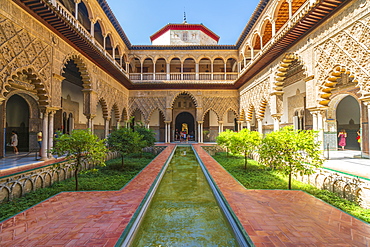 Patio de las Doncellas, a decorated courtyard and pool in typical Mudejar architecture, Real Alcazar, UNESCO World Heritage Site, Seville, Andalusia, Spain, Europe