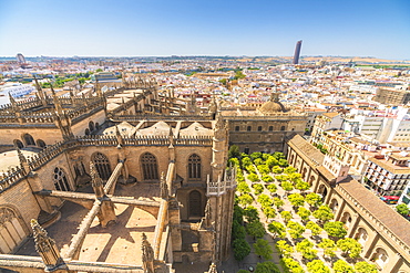 Overview of Seville Cathedral and Patio De Los Naranjos from the Giralda bell tower, UNESCO World Heritage Site, Seville, Andalusia, Spain, Europe