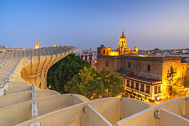 Illuminated Church of the Annunciation from rooftop of Metropol Parasol, Plaza de la Encarnacion, Seville, Andalusia, Spain, Europe