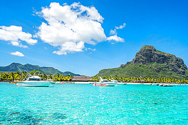 Boats in the turquoise sea surrounding the white sand beach, Le Morne Brabant, Black River district, Mauritius, Indian Ocean, Africa