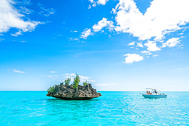 Tourists on boat trip admiring Crystal Rock in the lagoon, La Gaulette, Le Morne Brabant, Black River, Mauritius, Indian Ocean, Africa