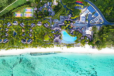 Aerial view by drone of luxury tourist resort on palm-fringed beach facing the tropical lagoon, Le Morne Brabant, Mauritius, Indian Ocean, Africa