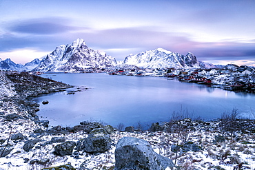 Pinksky dominates the scenery in Reine at dusk, Lofoten Islands, Arctic, Norway, Scandinavia, Europe