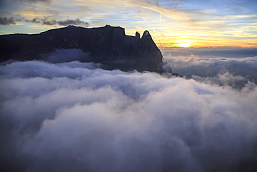 Aerial view of Santner peak at sunset, Sciliar Natural Park, Plateau of Siusi Alp in the Dolomites, Val Funes, Trentino-Alto Adige South Tyrol, Italy, Europe