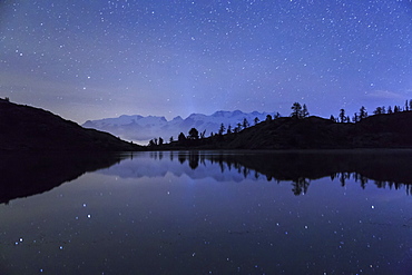 Starry night on Mount Rosa seen from Lake Vallette, Natural Park of Mont Avic, Aosta Valley, Graian Alps, Italy, Europe