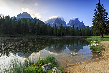 Cadini di Misurina group reflected in Lake Antorno at sunrise, Auronzo of Cadore, Veneto Sesto Dolomites, Italy, Europe