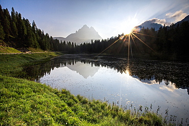 The Three Peaks of Lavaredo are reflected in Lake Antorno at sunrise, Veneto Sesto Dolomites, Italy, Europe