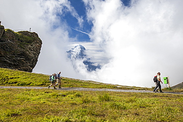 Hikers on the way to Mount Eiger, First Grindelwald, Bernese Oberland, Canton of Berne, Switzerland, Europe