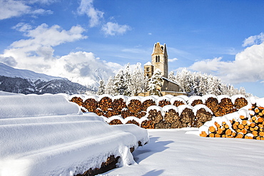 The church of San Gian surrounded by snowy woods, Celerina, Engadine, Canton of Grisons (Graubunden), Switzerland, Europe