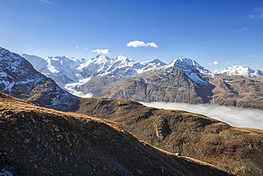 Low clouds toward Bernina Group, Languard Valley, Engadine, Canton of Grisons (Graubunden), Switzerland, Europe