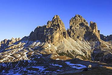 The lights of sunrise frames the Three Peaks of Lavaredo, Dolomites, Auronzo of Cadore, Veneto, Italy, Europe