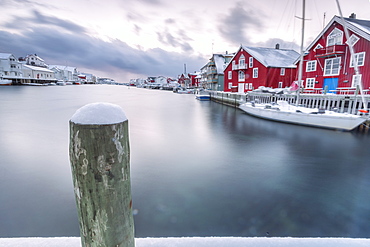 The typical fishing village of Henningsvaer with its red houses (rorbu), Lofoten Islands, Arctic, Northern Norway, Scandinavia, Europe