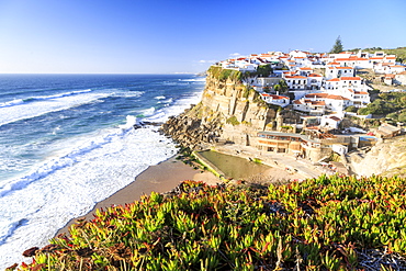 Top view of the village of Azenhas do Mar with the ocean waves crashing on the cliffs, Sintra, Portugal, Europe