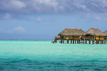 Overwater bungalows in luxury hotel in Bora Bora, Society Islands, French Polynesia, Pacific