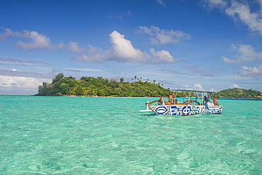 Little boat in the turquoise lagoon of Bora Bora, Society Islands, French Polynesia, Pacific