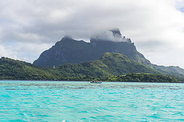 The volcanic rock in the turquoise lagoon of Bora Bora, Society Islands, French Polynesia, Pacific