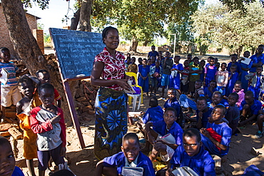 Primary school on a dusty street with many children, Liwonde National Park, Malawi, Africa