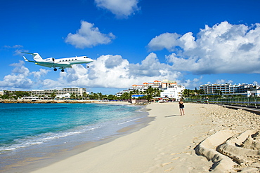 Airplane flying in the Princess Juliana International Airport of Maho Bay, Sint Maarten, West Indies, Caribbean, Central America