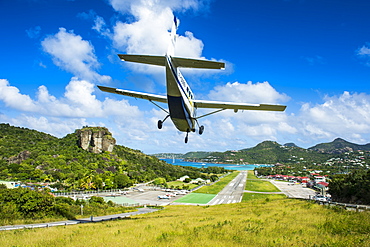 Small airplane landing at the airport of St. Barth (Saint Barthelemy), Lesser Antilles, West Indies, Caribbean, Central America