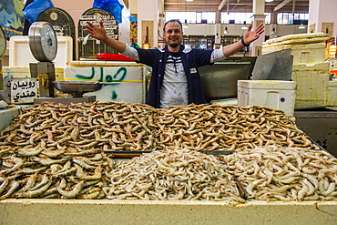 Local fisher man showing his fish, Fishing market, Kuwait City, Kuwait, Middle East