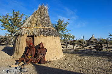 Himba women in front of their hut, Kaokoland, Namibia, Africa