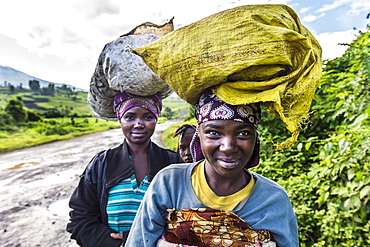 Local women carrying goods on their heads, Virunga National Park, Democratic Republic of the Congo, Africa