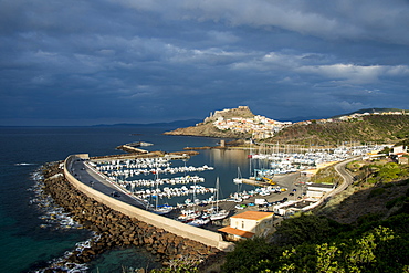 Dramatic light over the old town of Castelsardo with its boat harbour, Sardinia, Italy, Mediterranean, Europe