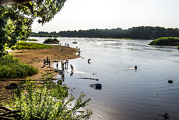 Local people playing in the waters of the White Nile River, Juba, South Sudan, Africa