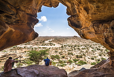 Local guide sitting in one the Laas Geel caves, Somaliland, Somalia, Africa