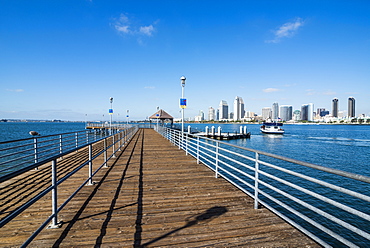 Boat pier in front of the skyline of San Diego, California, United States of America, North America